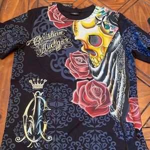New Christian Audigier t shirt. Great looking shirt. Xxl but fits like a L/XL.